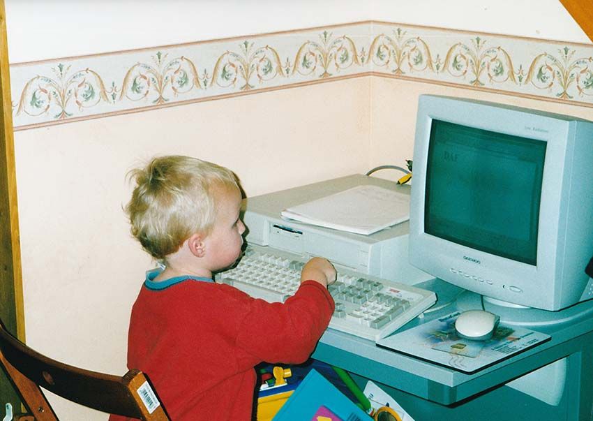 A photo of when I was very young (around 3), sat in-front of a computer tapping keys on the keyboard.